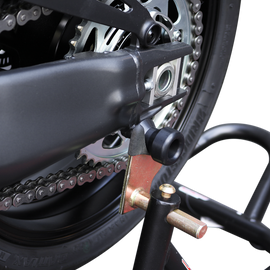 Black Shogun swingarm sliders mounted on a Yamaha motorcycle, designed to protect the body and improve bike stability.