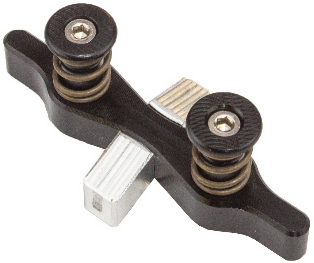Tamer Double Button Holeshot Device suspension component designed for off-road vehicles, showcasing the device with buttons and mounting points.