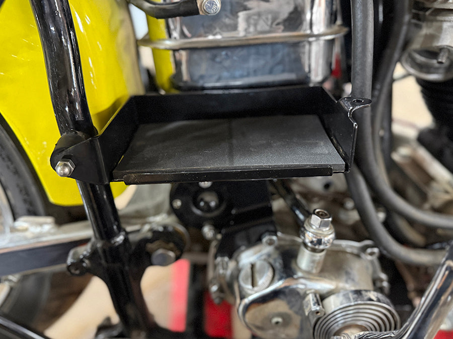 V-Twin black battery carrier kit for electrical systems, featuring a sturdy V-Twin brand design and durable construction.