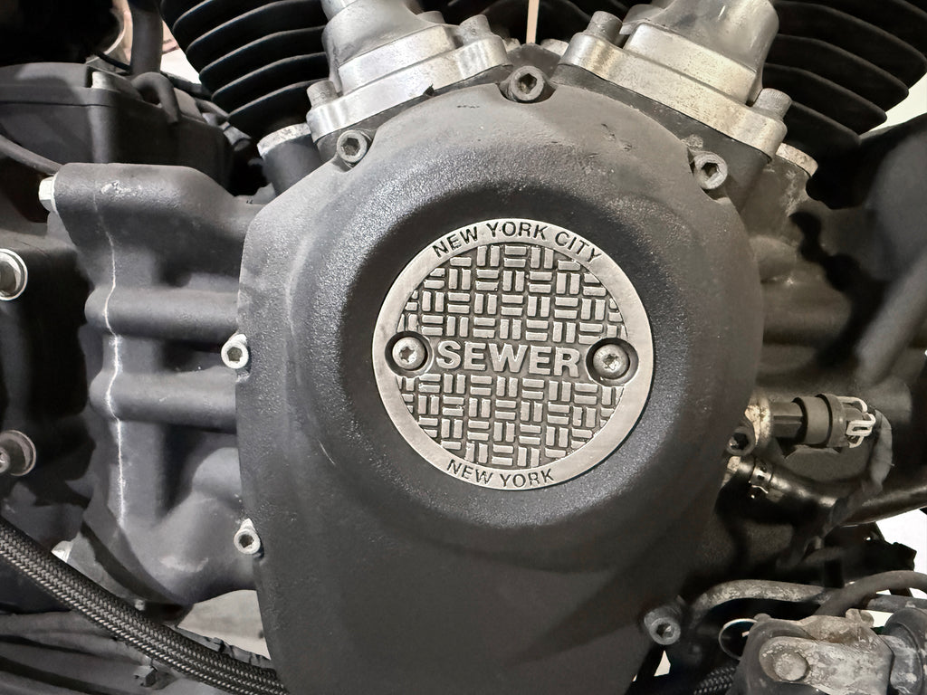 V-Twin M8 NYC electrical ignition cover with two holes, designed for motorcycle ignition system protection.