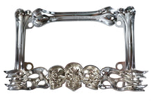 Load image into Gallery viewer, Chrome V-Twin skull style license plate frame, designed for motorcycle lighting, with a bold skull motif and polished finish.