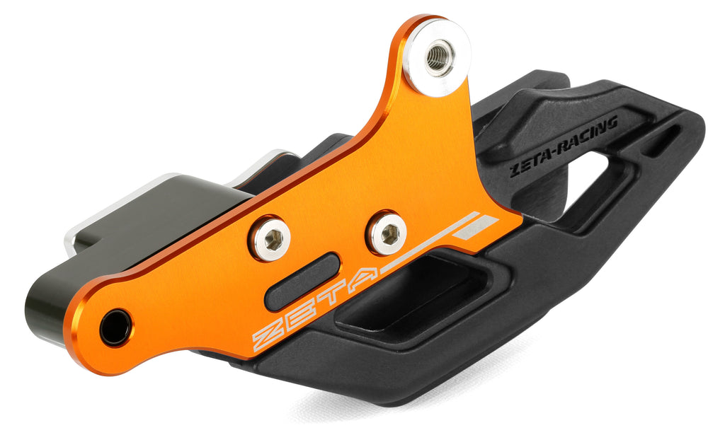ZETA 3D chain guide in orange for KTM motorcycles, drive part with detailed mounting features and branding visible.