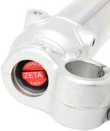 ZETA front fork bottom adjuster for suspension, showing the black metal component with adjustment screws and branding details.