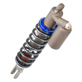 ZETA suspension preload adjuster for KYB 634-13026, mounted on vehicle suspension, showing detailed metal component.