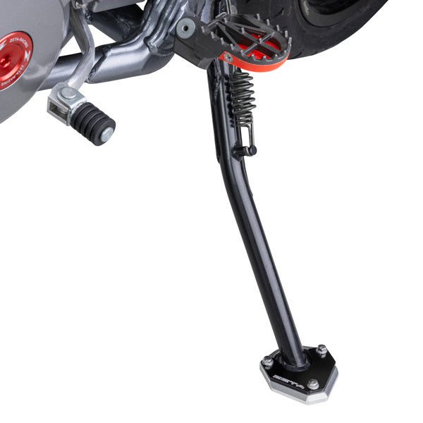 Pair of ZETA Side Stand Extenders for motorcycle, durable metal construction, designed to improve side stand stability.