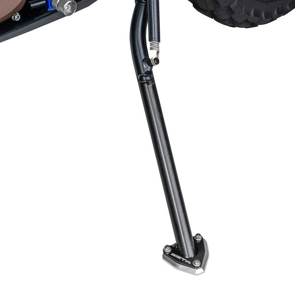 Pair of ZETA Side Stand Extenders for motorcycles, showing two black metal extensions with mounting hardware.