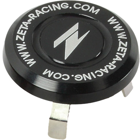 Black ZETA stem cap for motorcycle handlebars, featuring a sleek design and durable construction.
