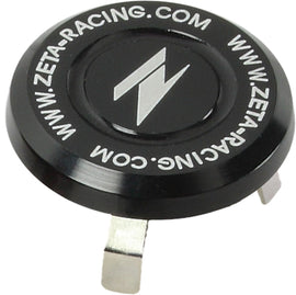 Black ZETA stem cap for motorcycle handlebars, featuring a sleek design and durable construction.